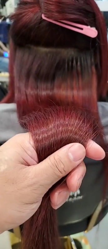 Red hair colour result at Bazaar Hair Salon Geylang